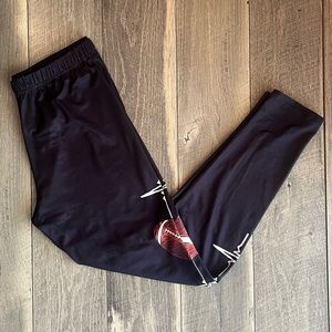 🏈NWOT Black Football Themed Woman’s Leggings Size XL